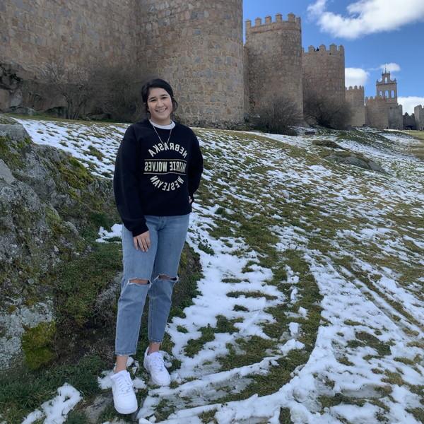 Jacqueline Garcia standing in front of a castle in Spain